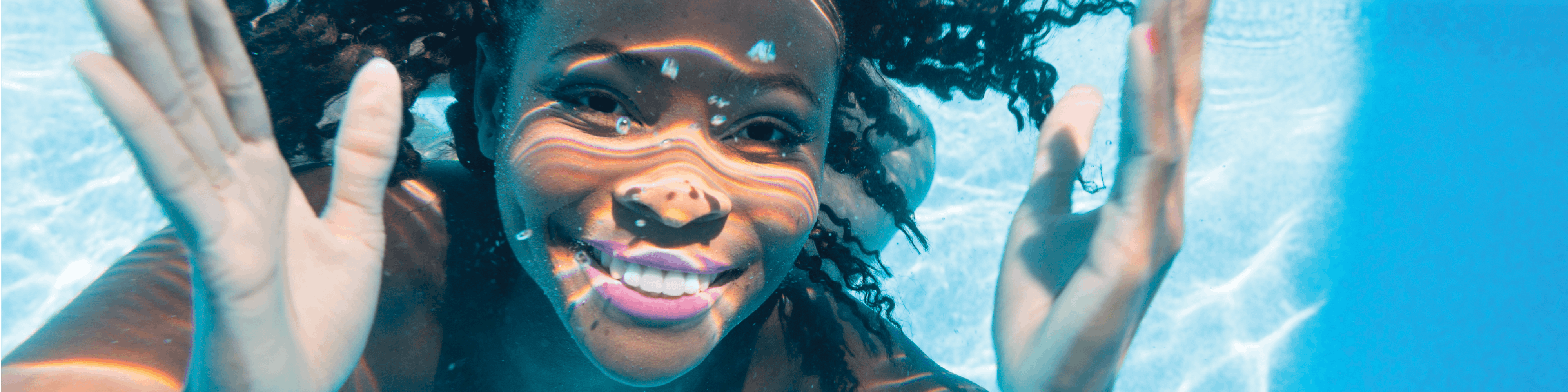 Lady swimming in pool